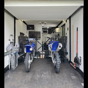 two dirt bikes in toyhauler trailer