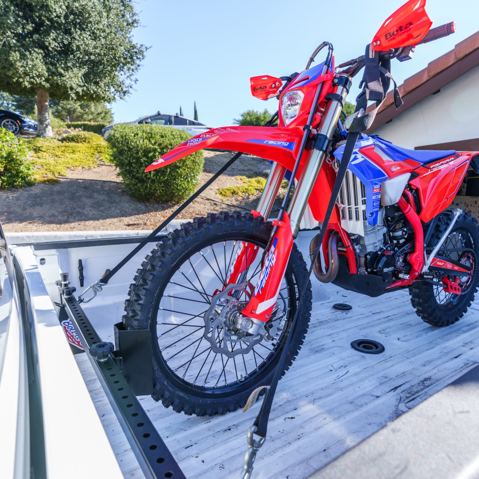 Dodge truck motorcycle and bicycle tool free tie down system