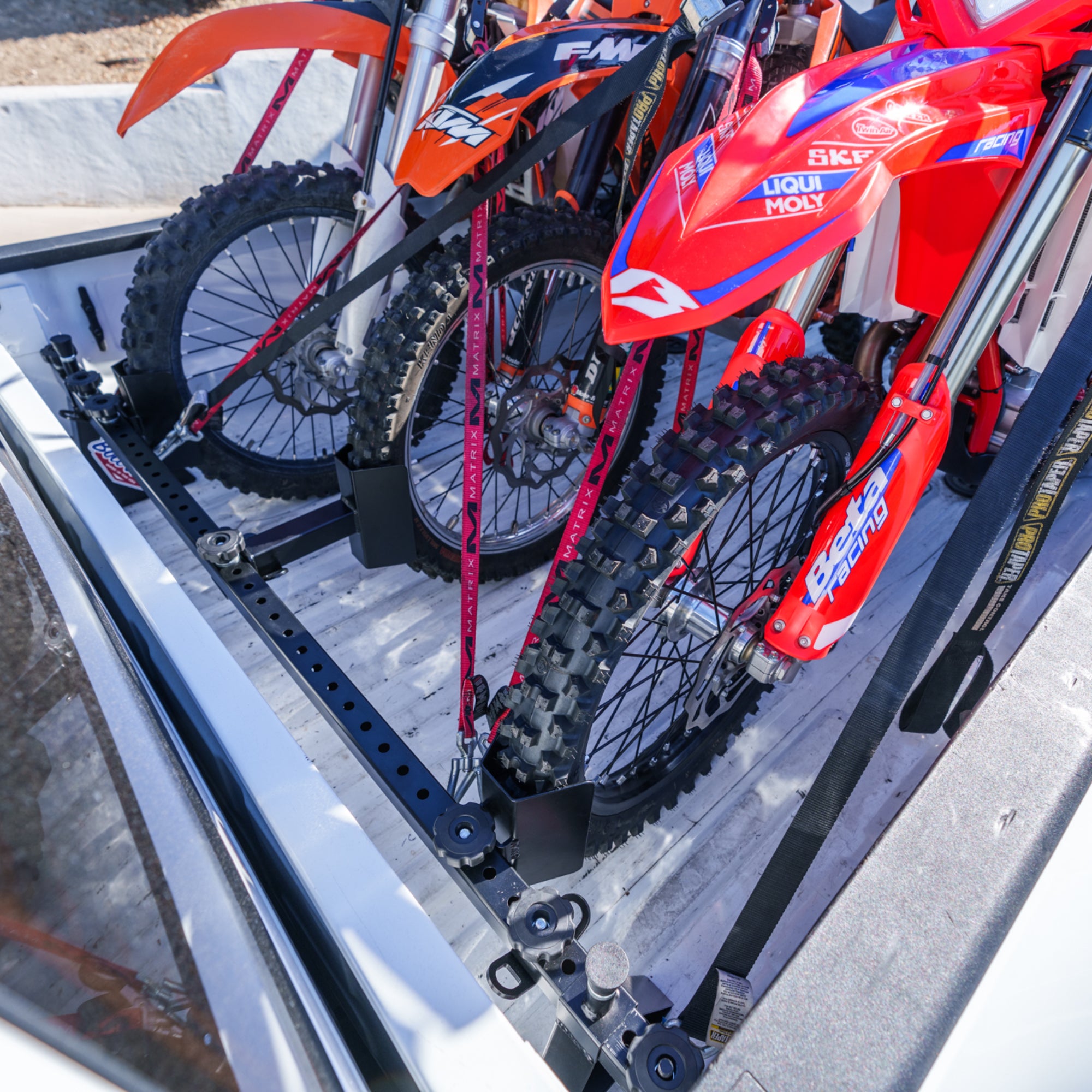 Bicycle and motorcycle tie down system for dodge ram