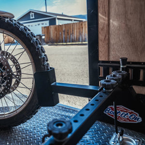 An Extended wheel chock for a motorcycle.