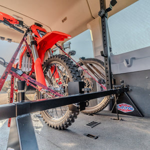 Beta Dirt Bike secured to a Bolt It On System in a Ford Transit Van