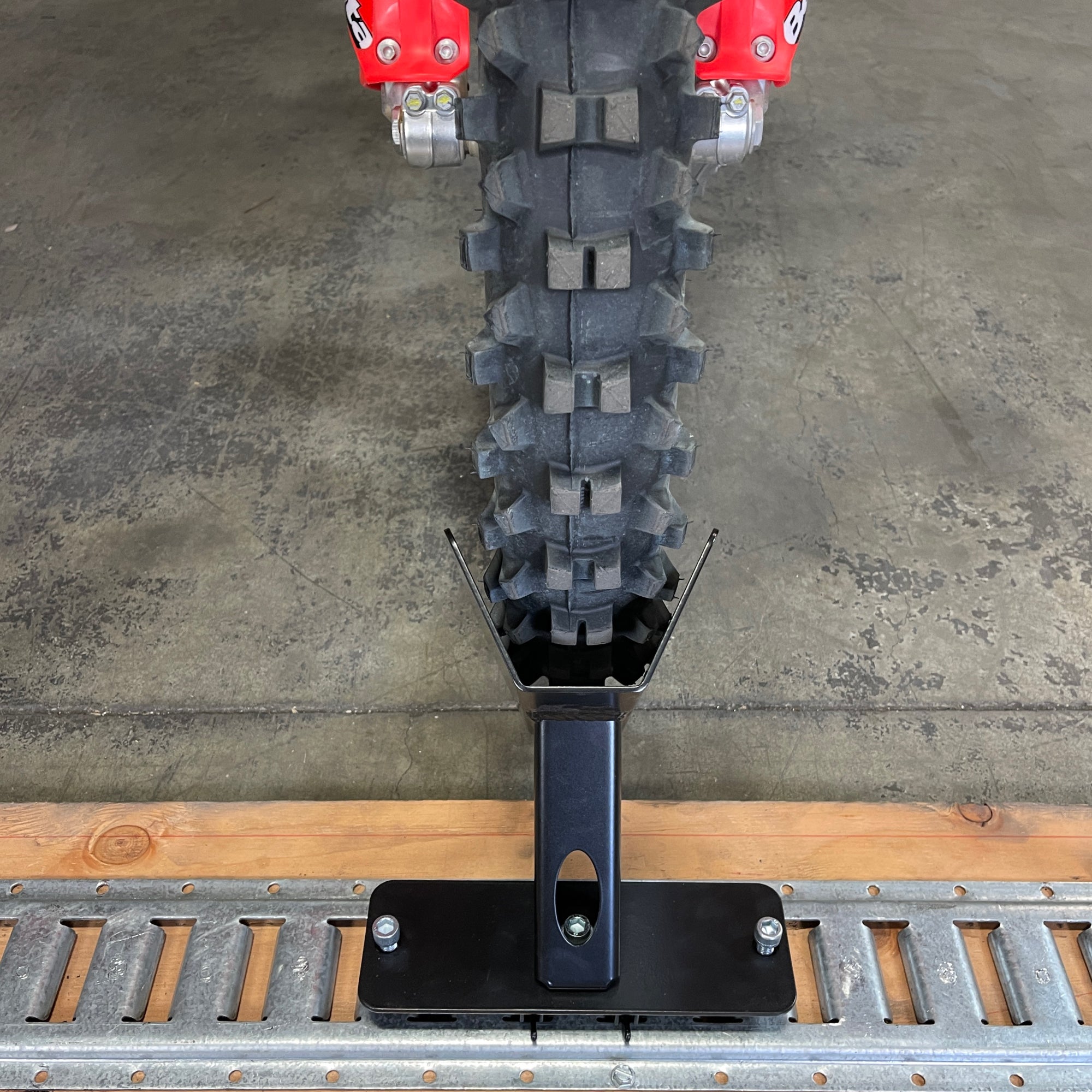 E-Track floor mount wheel chock for dirt bikes and mountain bikes