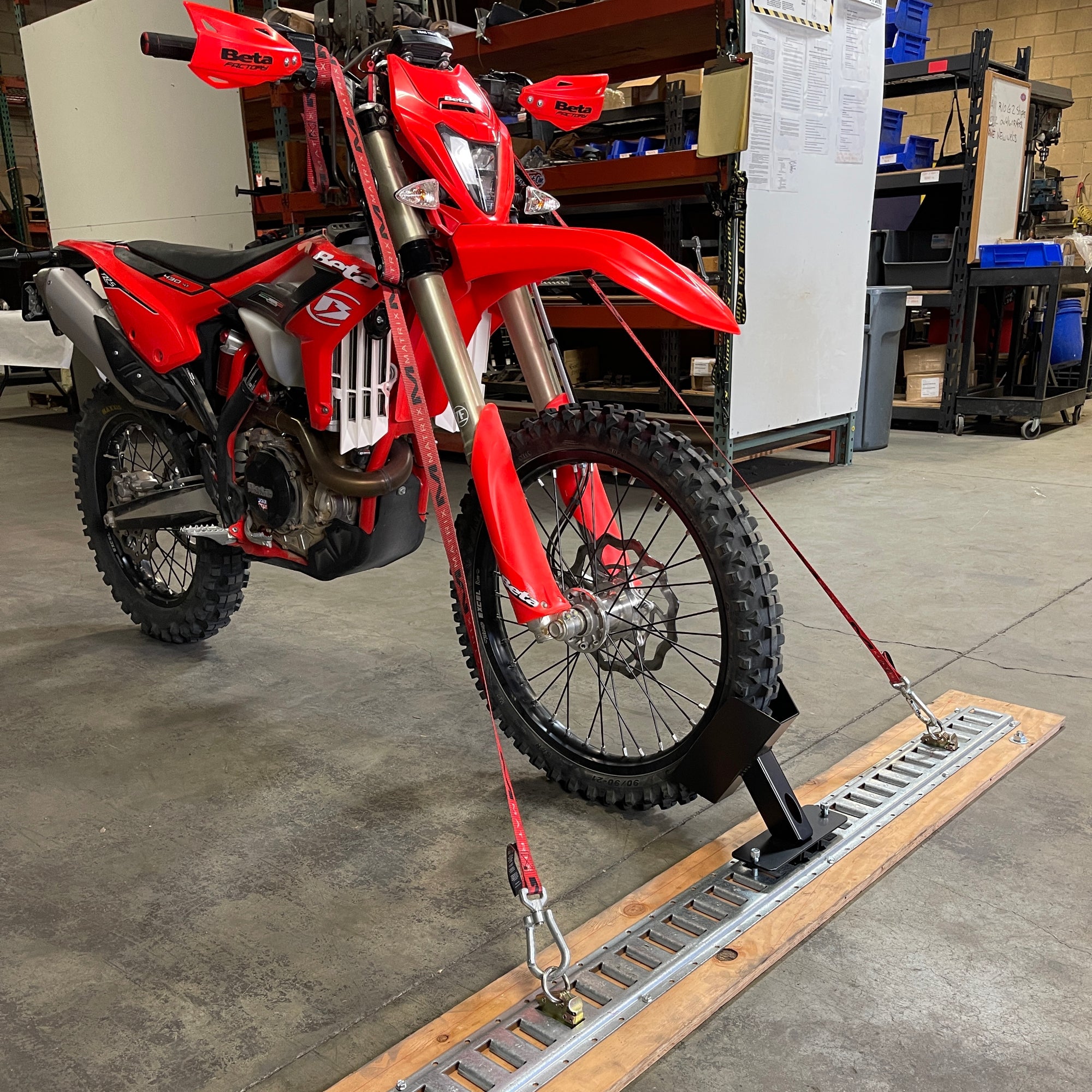 Motorcycle floor mounted wheel chock
