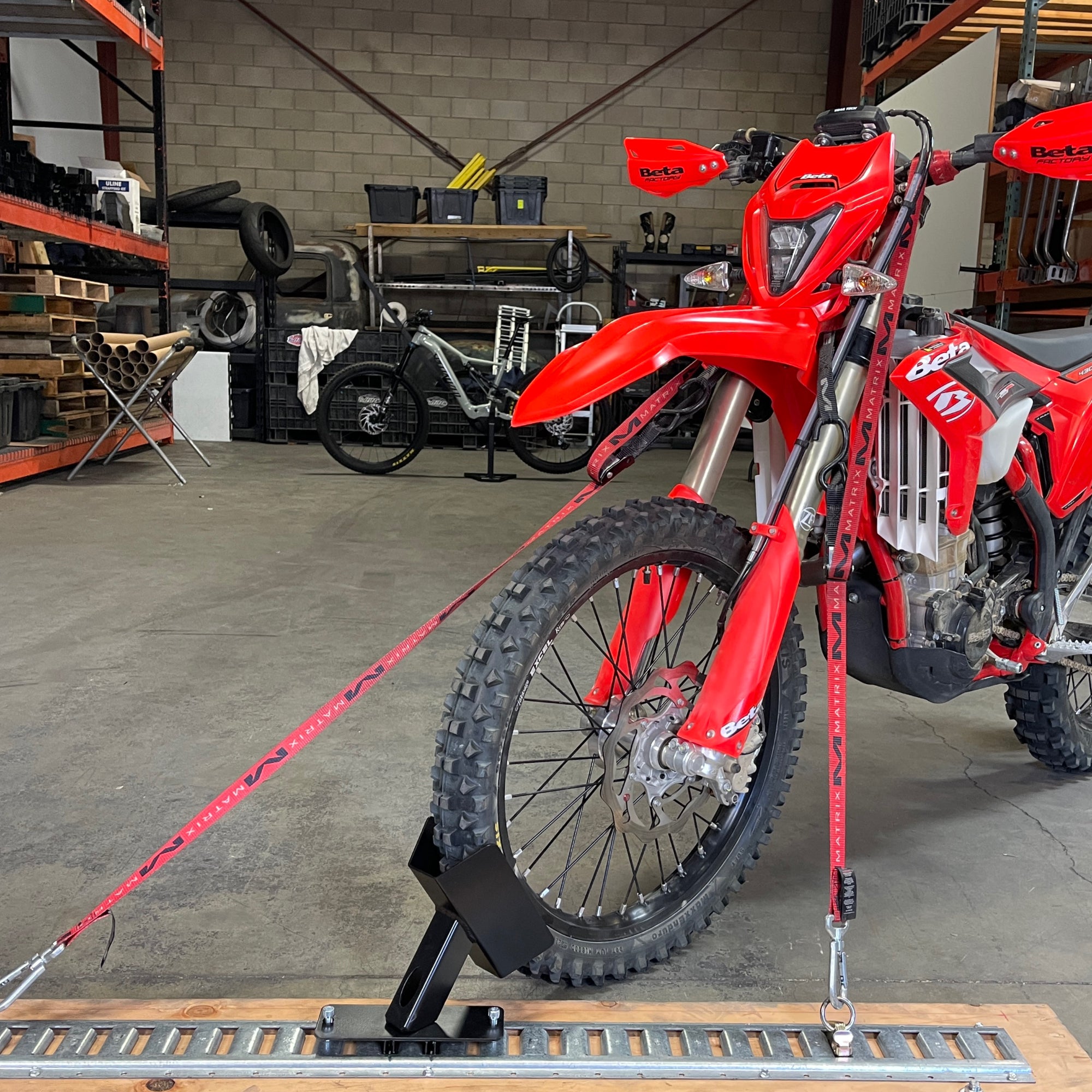 Motorcycle floor mounted wheel chock