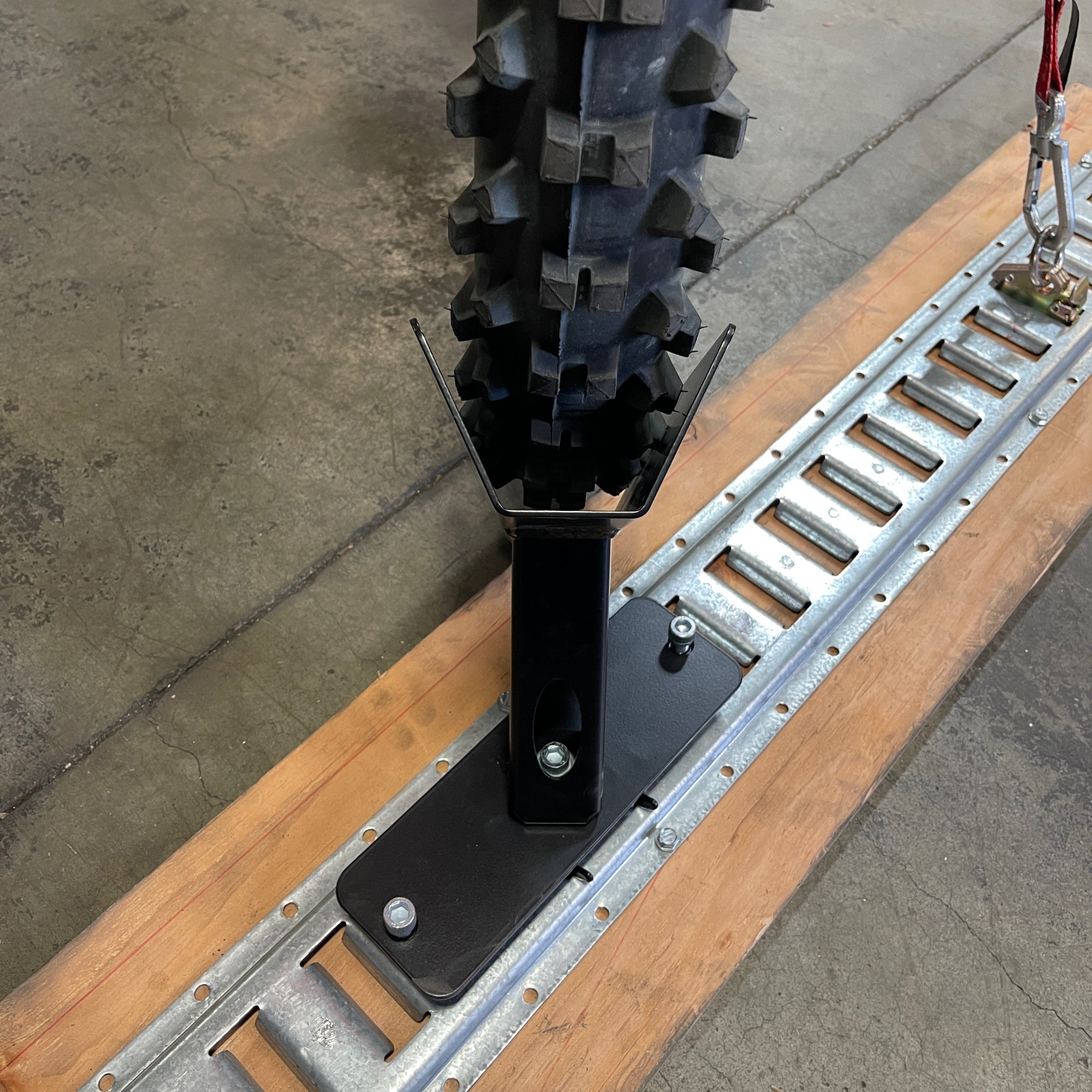 Motorcycle floor mounted wheel chock