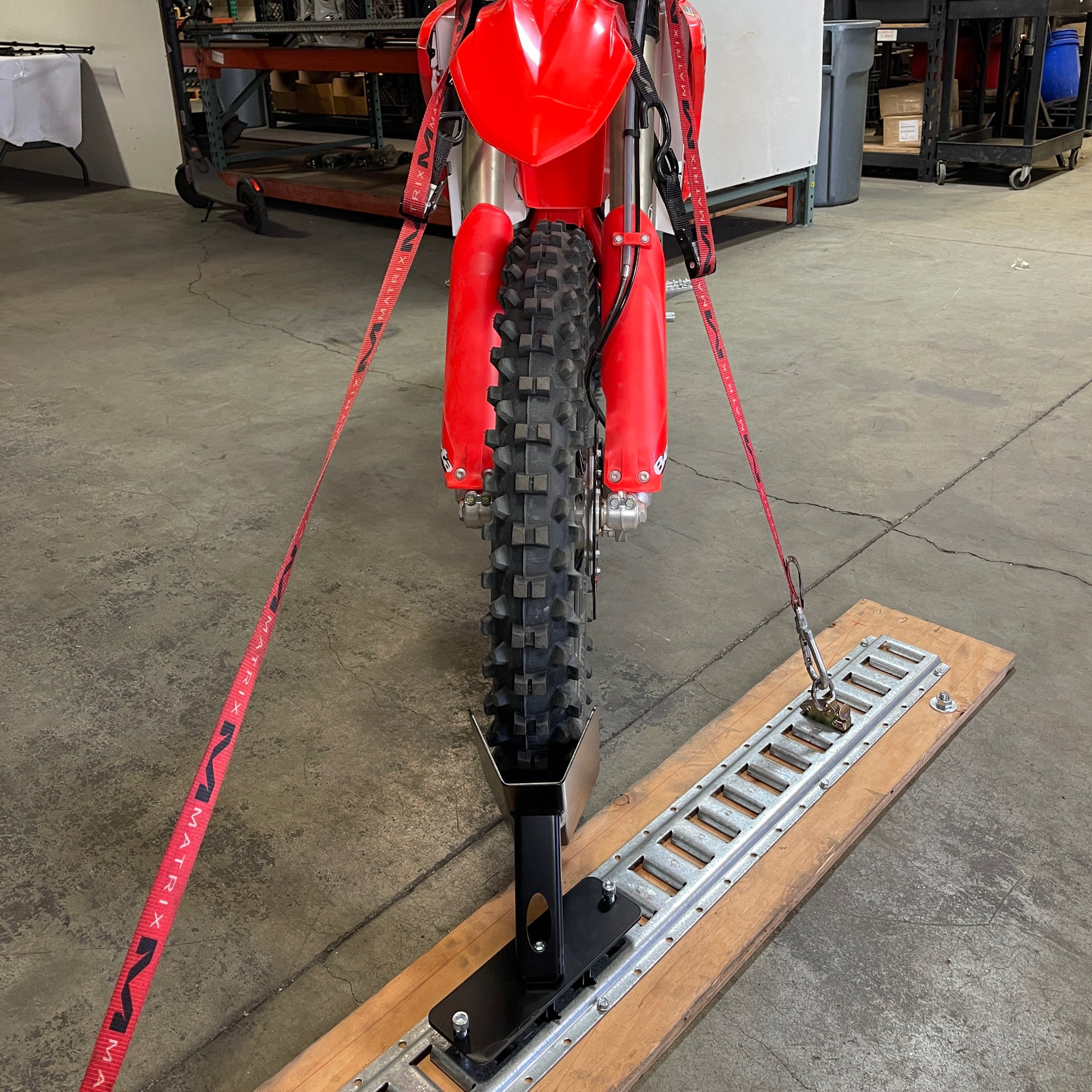 Motorcycle floor mounted wheel chock