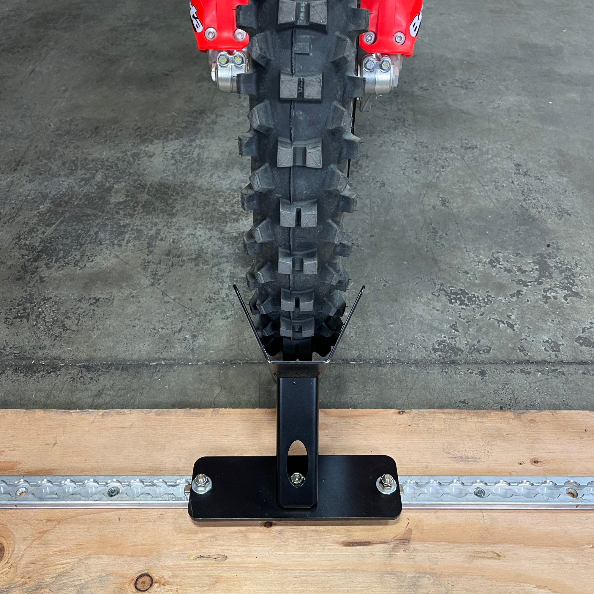 L-Track floor mount wheel chock for dirt bikes, sport bikes, bicycles and fat tire e-bikes